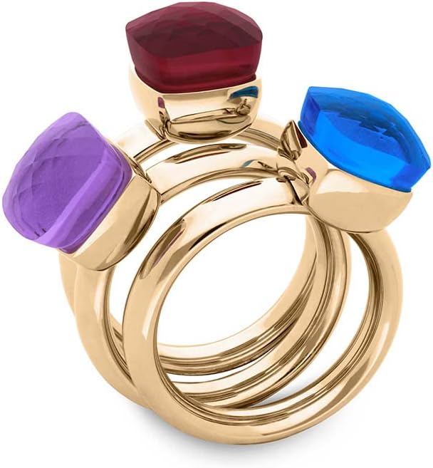 Three QUDO FIRENZE rings in gold, each with a different colored square crystal (purple, red, blue), stacked together.