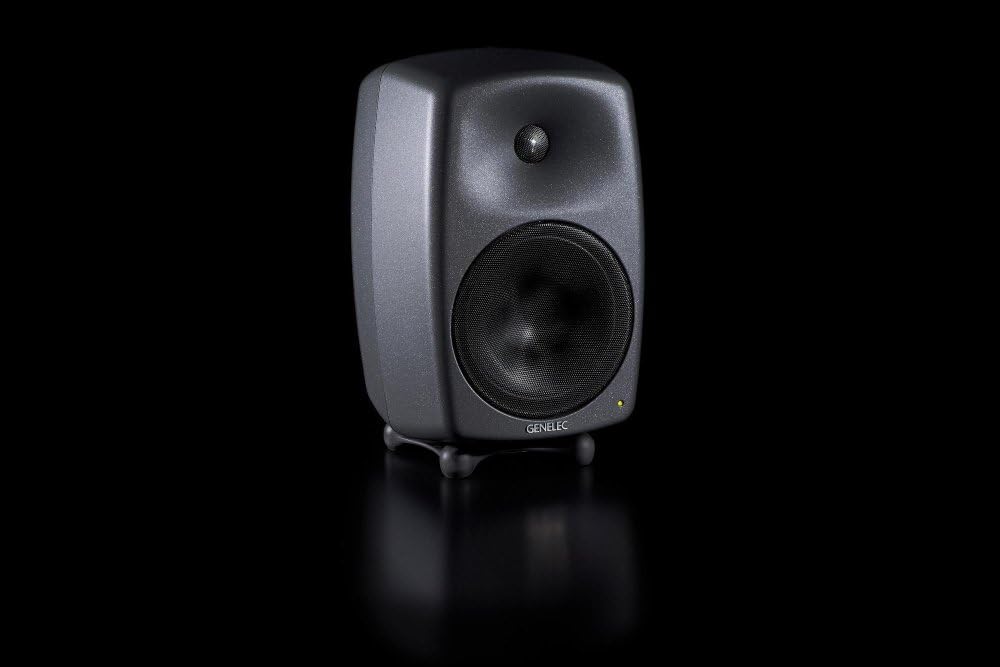Genelec 8050B monitor from an angle with the power indicator light illuminated