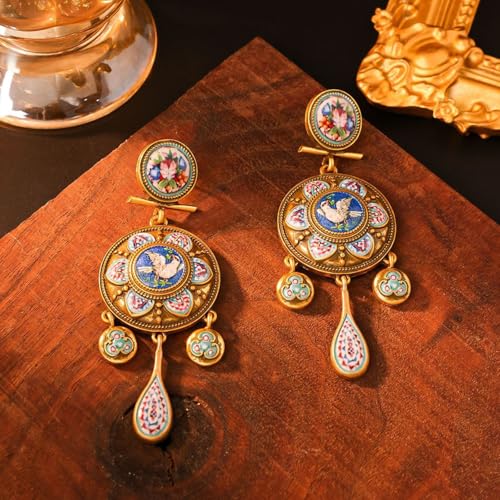 Boucles d'oreilles historiques Peace Bird légères pour sublimer un visage sans douleur