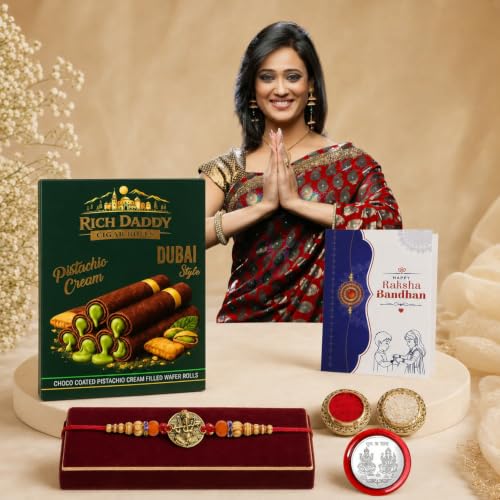 Image of DeoDap Rakhi with Chocolate for Brother - Golden Color Round Ganesha Style Rakhi with Pistachio Cream Cigar Rolls, Silver Color Coin, Greeting Card & Tilak Set - Raksha Bandhan Pack (k1 1130 CG-P)