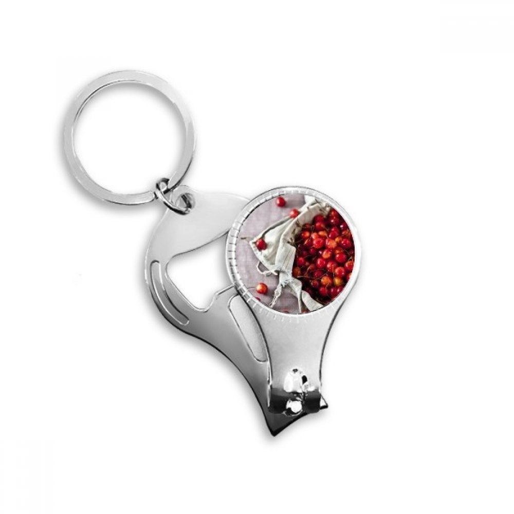 Coupe-ongles cerise et fruits rouges pour trousse de voyage