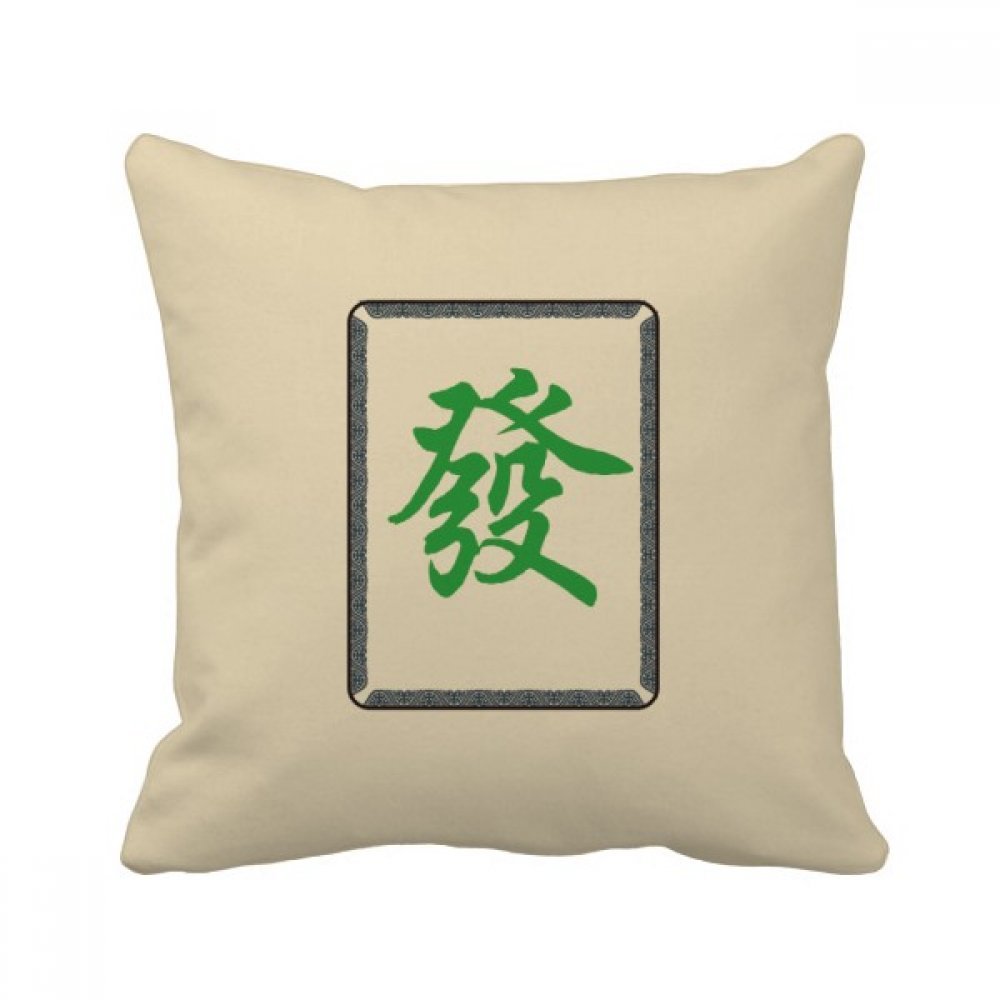 Coussin mahjong vert confortable pour soulager le dos sur canapé