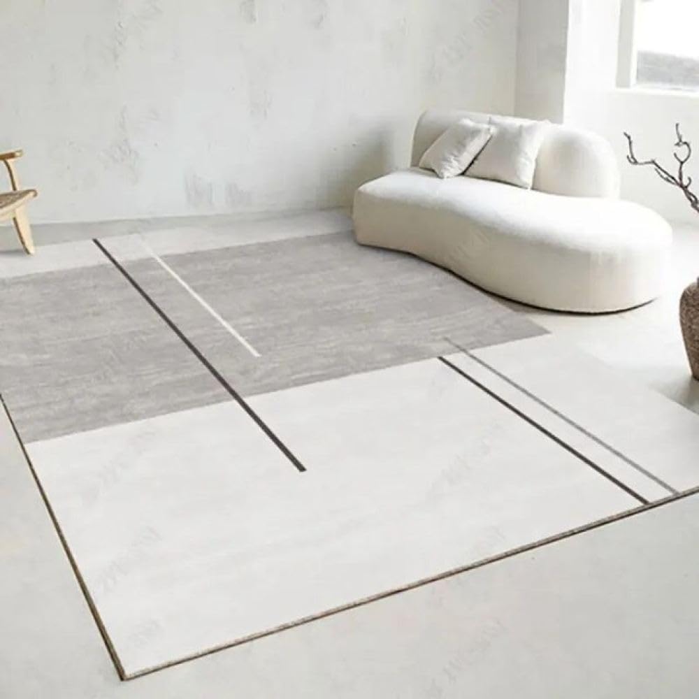 Grand tapis de chambre en velours blanc doux sous un bureau simple et moderne