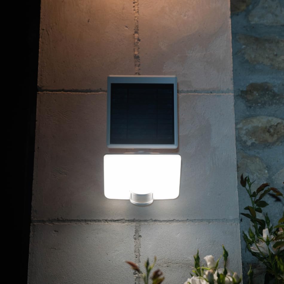 Xanlite PRS1500DB Solar Spotlight mounted on an outdoor wall, illuminating the area below.