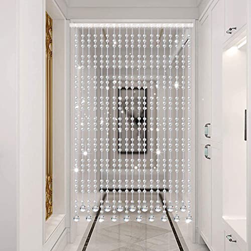 Rideaux de séparation de pièce en cristal pour structurer un studio sans perdre de lumière