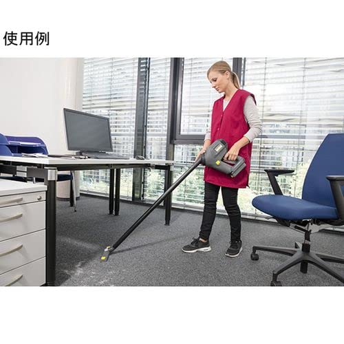 Woman vacuuming office carpet with Kärcher HV 1/1 Bp
