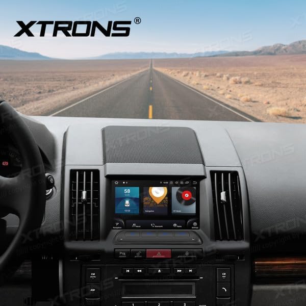 Image showing the XTRONS IQ72DLRP car stereo installed in the dashboard of a Land Rover Freelander 2, demonstrating its integrated appearance.