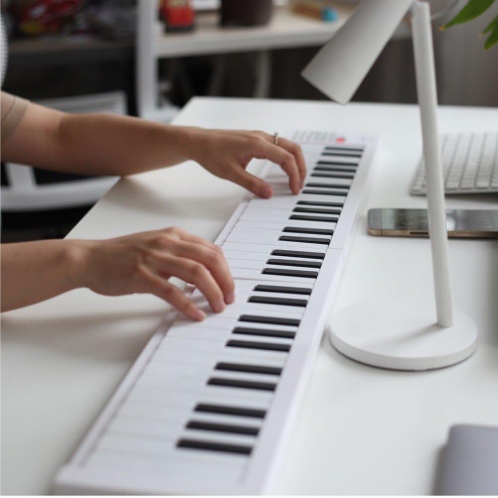 Piano Electrónico Plegable De 61 Teclas: Teclado Ligero Y Portátil para Viajes Y Aprendizaje En Casa.