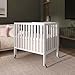 Dream On Me Jett Mini Folding Baby Crib in White, GreenGuard Gold & BSA, Lightweight & Portable, Patented Flat Folding System for Small Spaces & Travel, 1.5” Mattress Pad, 3 Heights, Safe Wheels