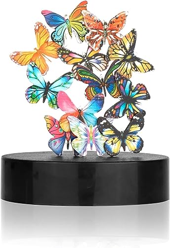 Metallic butterfly pieces that snap and hover in gravity-defying arrangements on a circular magnetic base — weirdly elegant desk fidget.