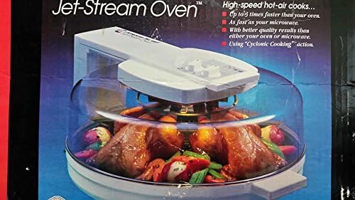NESCO Jet Stream Oven 2000 with lid open, showing food cooking inside