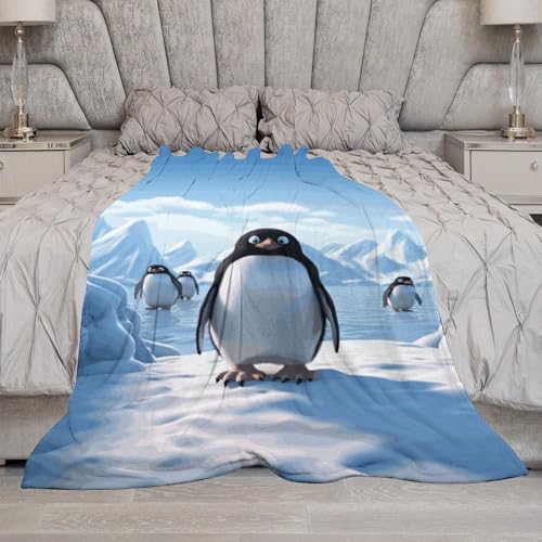 Couverture flanelle pingouin pour soirée cocooning sur le canapé