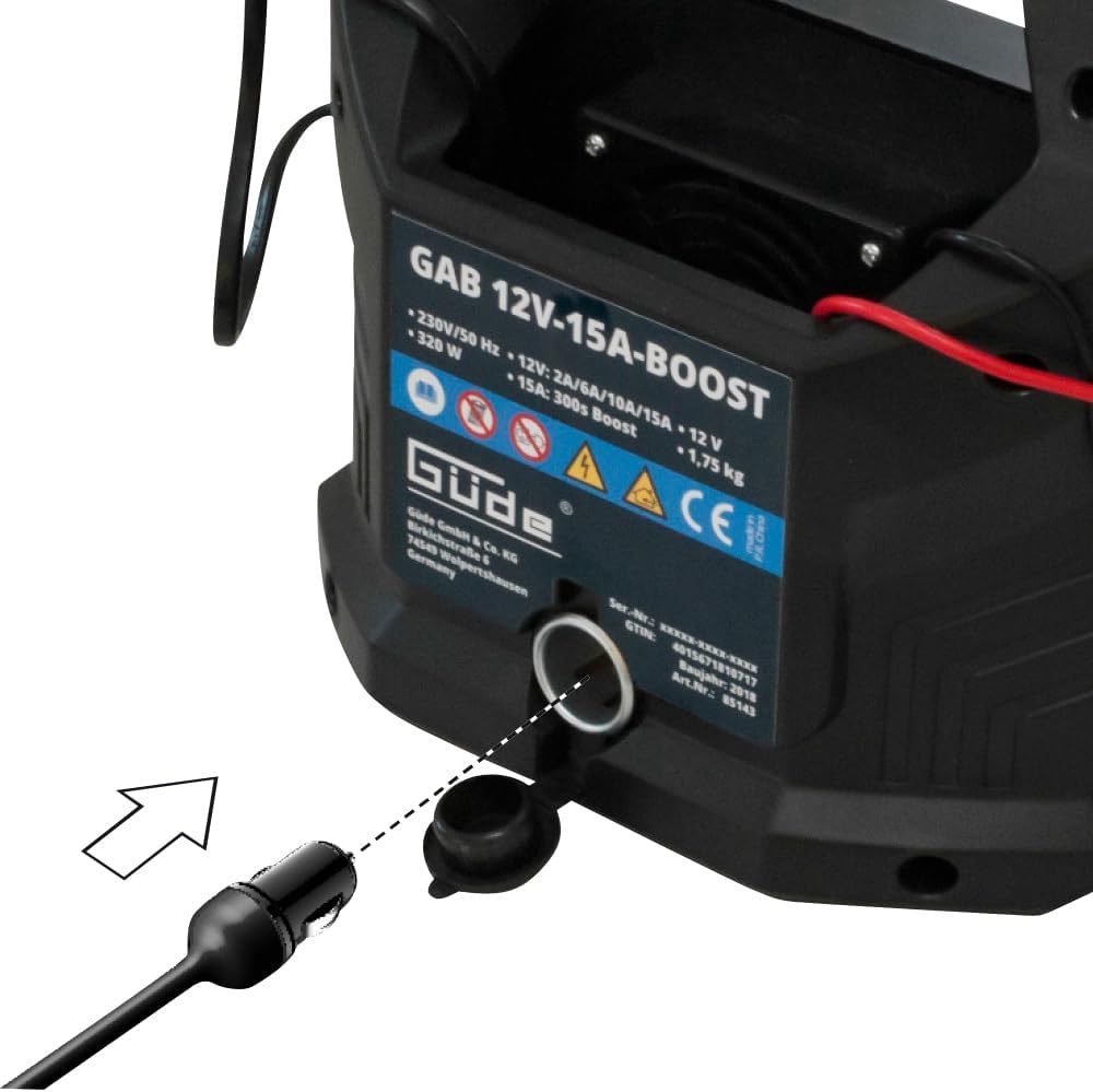 Close-up of the 12V cigarette lighter adapter connected to the GÜDE GAB 12V-15A-BOOST charger.