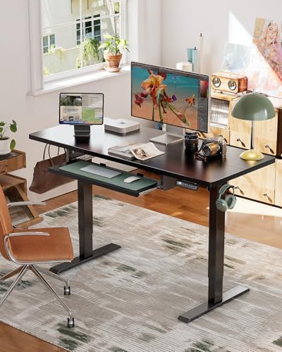 Close-up of the ergonomic keyboard tray with a user's hands typing comfortably.