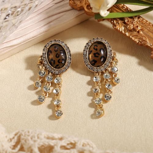 Boucles d'oreilles léopard pendantes strass doré pour look soirée