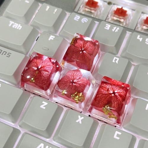Keycaps artisanaux en résine époxy et fleurs séchées pour clavier mécanique