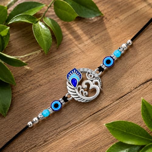 Image of Riddhika Ventures Religious Meenakari Om and Peacock Feather Rakhi With Roli Chawal And Greeting Card