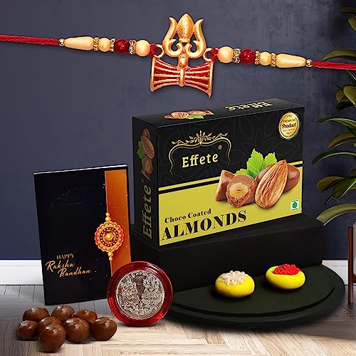 Image of DeoDap Multicolor Trishul Roli Chawal Rakhi Rakhi with Chocolate Almonds 32gm, Silver Pooja Coin, Tilak Set, Greeting Card - Rakhi Gift for Brother