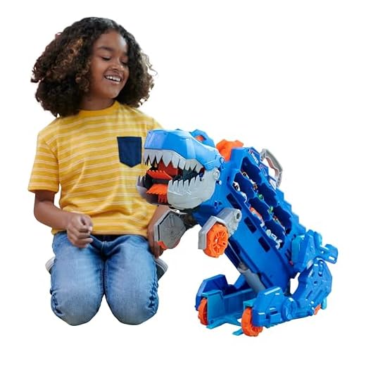 Hot Wheels 2:1 Transporter zu T-Rex mit inkl. Autorennbahn, mit Beleuchtung und Geräuschen, inkl. 2 Spielzeugautos, Platz für 20 Autos, Auto Spielzeug, Hot Wheels Dino, Spielzeug ab 4 Jahre, HNG50