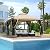 Outsunny 10' x 10' Patio Gazebo with Corner Shelves, Outdoor Gazebo Canopy Shelter with Netting, and Vented Roof, for Garden, Lawn, Backyard and Deck