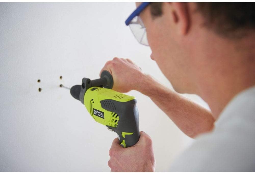 Close-up of user drilling into a wall with Ryobi RPD500-G