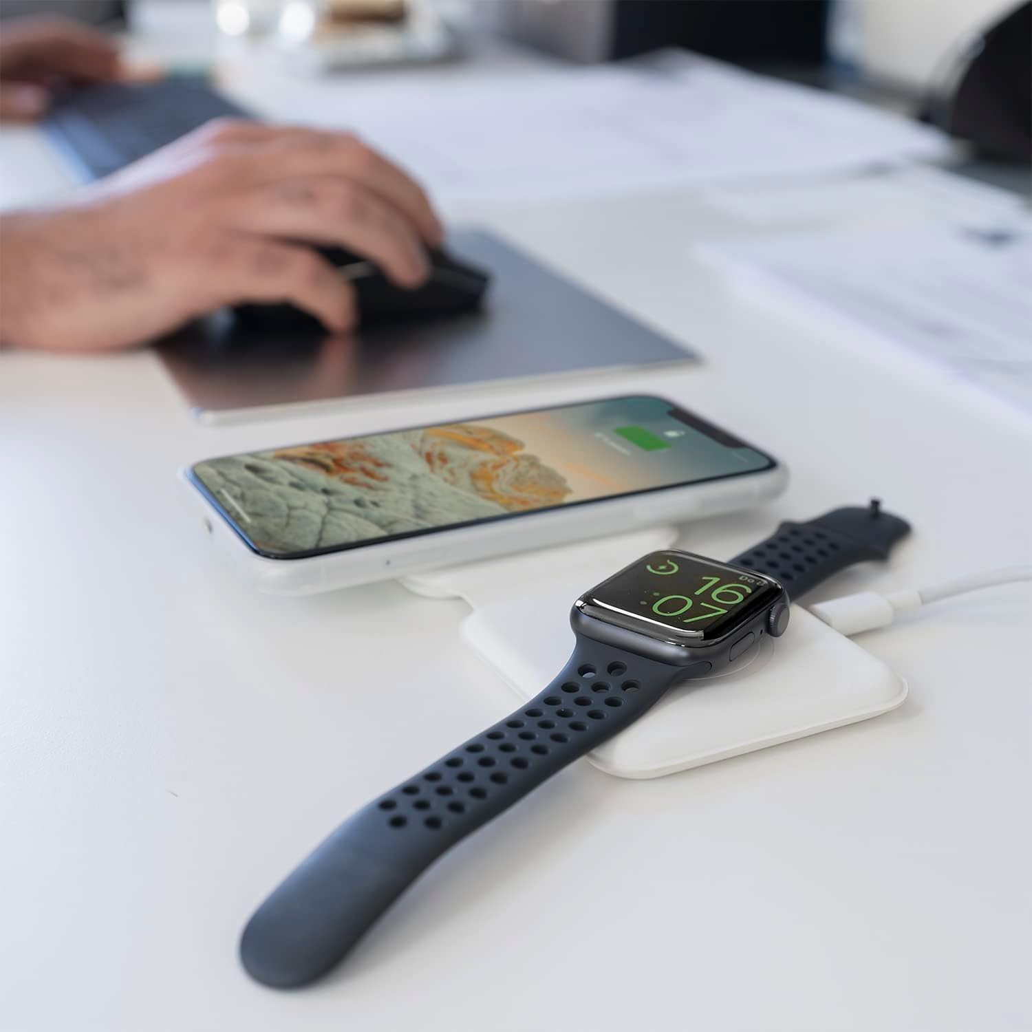 4smarts Dual Foldable Wireless Charger in use on a desk, charging a smartphone and a smartwatch