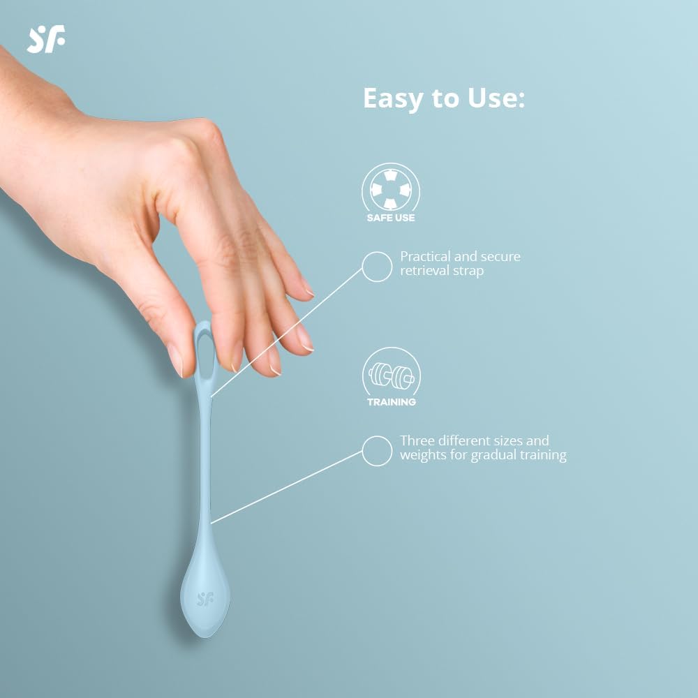 Hand holding a Satisfyer Yoni Power 2 Kegel Ball, showing the retrieval loop
