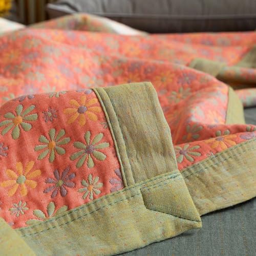 Couverture boho réversible pour des soirées cocooning chaleureuses sur le canapé du salon