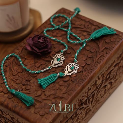 Image of 925 Sterling Silver Peacock Feather with Green Stone Rakhi for Bhai Cotton Thread | Rakshabandhan Rakhi With Greeting Card & Roli Chawal and Certificate of Authenticity