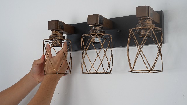 Image of 3-Light Black Gold Farmhouse Vanity Light, Wood & Metal Cage Shade | Mounted Over Mirror, Industrial Rustic Style, Ideal for Bathroom, Bedroom, Hallway & Living Room, Easy To Install