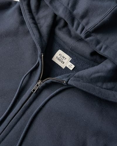 A person's hand adjusting the brightness and color temperature settings on a modern LED desk lamp.