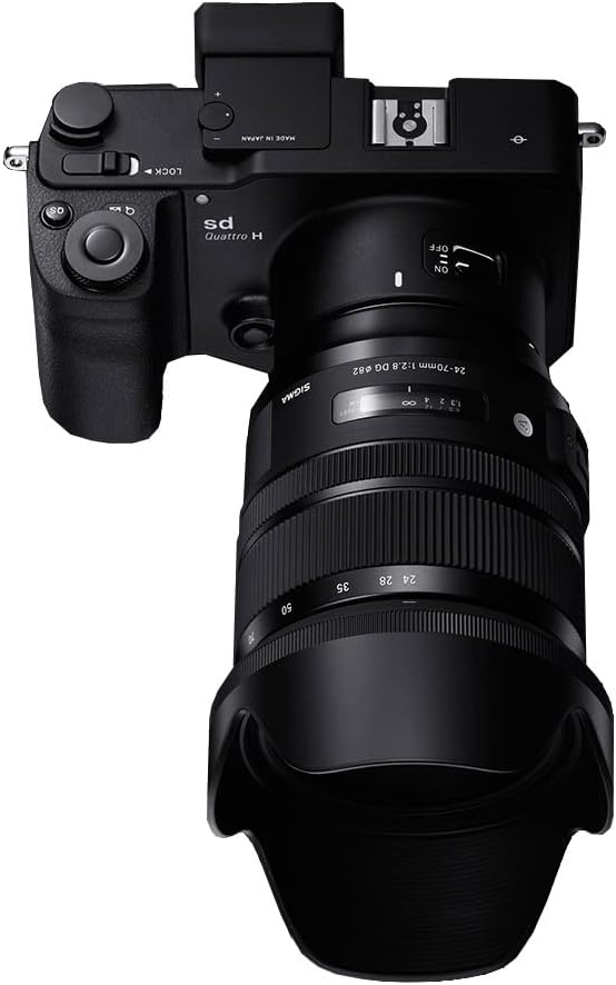 Sigma 24-70mm f/2.8 DG OS HSM Art Lens mounted on a camera, top view