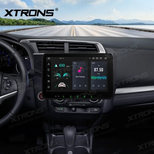 XTRONS TX123GS Autoradio installed in a car dashboard, displaying the main interface with music and radio controls.