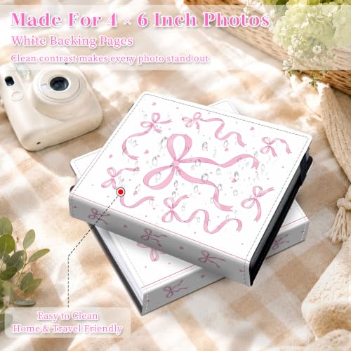 Image of Photo Album 4x6 120 Pockets Pink Ribbon Bow Pattern | 120 clear 4x6 photo pockets, strong elastic band, compact album, family travel wedding use, pink ribbon bow cover