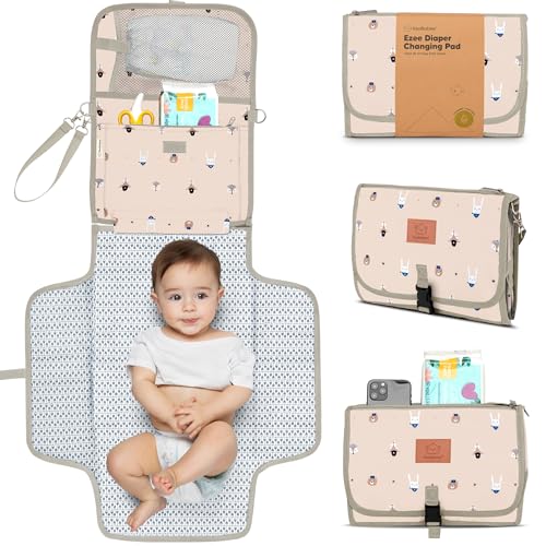 Image of KeaBabies Portable Diaper Changing Pad - Large Waterproof Baby Changing Mat, Compact Travel Diaper Clutch, Functional Pockets Fit Newborn Essentials, Wipeable & Padded Baby Changer (Wild Patrol)