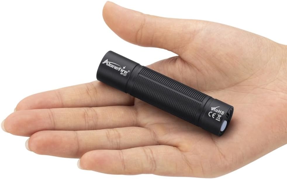 Alonefire SV127 UV Flashlight held in a hand for size reference