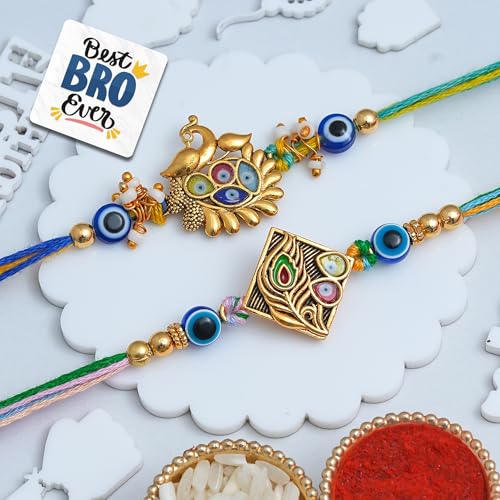 Image of eCraftIndia Peacock Feather Evil Eye Rakhi Set of 2 | Rakhi for Brother Bhaiya Bhai with Best Bro Ever Fridge Magnet | Roli Chawal Pack