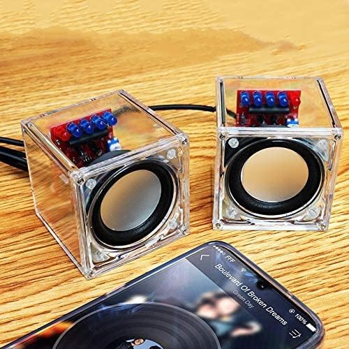 Nog een view of the two assembled Gikfun Mini Amplifier speakers connected to a smartphone, highlighting their compact size and clear enclosures.