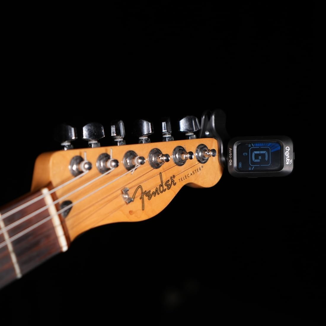 Cherub WST-645 tuner clipped onto the headstock of a guitar.
