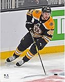Matt Grzelcyk Boston Bruins Unsigned Jersey Skating with Puck vs. Carolina Hurricanes Photograph - Original NHL Art and Prints