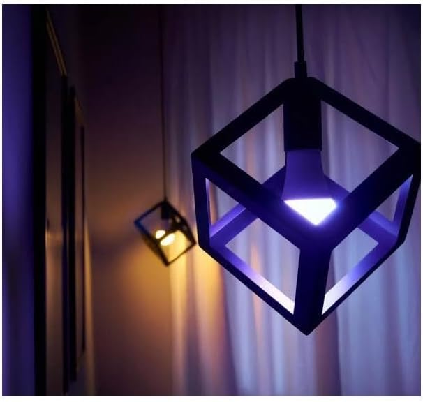 Shelly Duo RGBW E27 bulb emitting purple light in a modern fixture