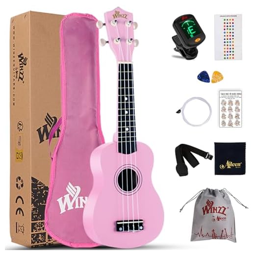 Winzz Ukelele Soprano Starter Kit para Principiante. Incluye: Funda, Afinador, Cuerdas Extra, Correa Ajustable, Púas, Pegatinas de notas, Guía de Acordes y Paño de pulido. Color: Rosa