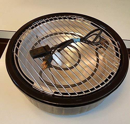 Жогорку view of the A Rival 5750 Indoor Electric Crock Grill showing the heating element, grill grate, and power cord.