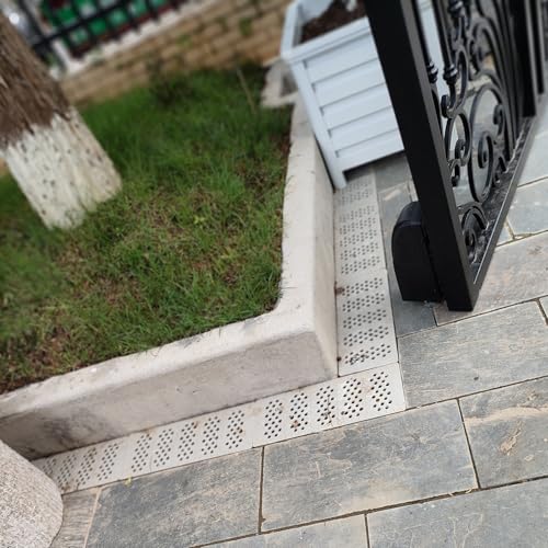 Grille de caniveau robuste perforée pour allée de garage et parking
