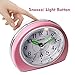 MEKO Alarm Clocks for Bedrooms, Small Battery Powered Travel Alarm Clock with Snooze and Nightlight, Silent No Ticking Bedside Clock(Pink)