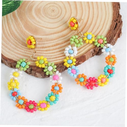 Boucles d'oreilles perle fleur pour sublimer une coiffure de mariage bohème