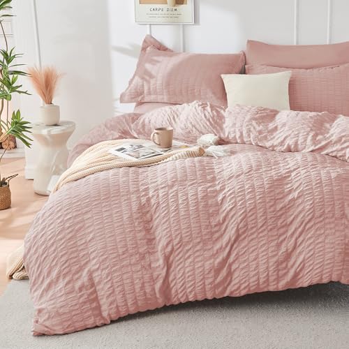 Image of HYMOKEGE Rose Gold Oversized King Comforter Set Seersucker 7 Pieces, All Season Luxury Bed in a Bag for Bedroom, Bedding Set with Comforter, Sheets, Pillowcases & Shams