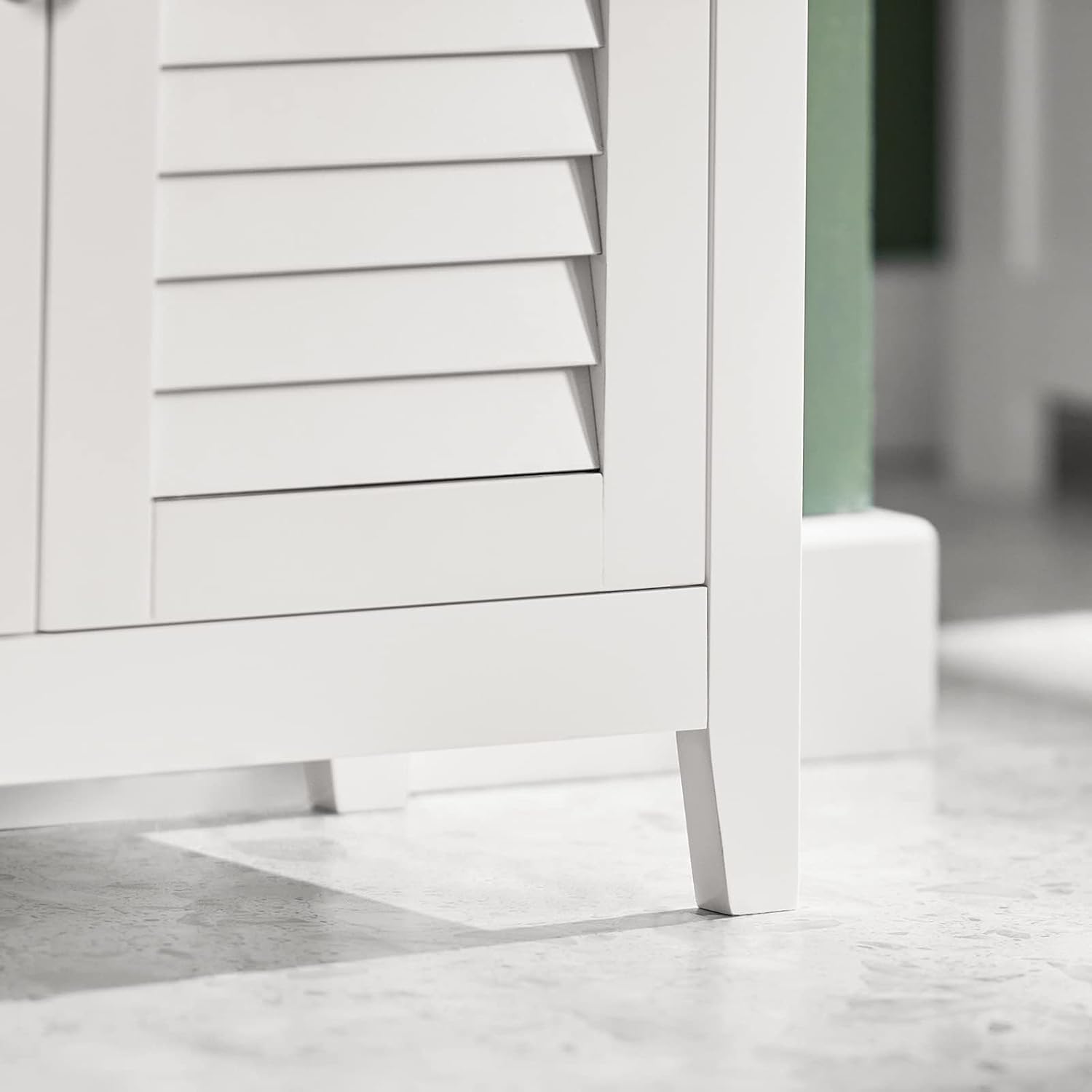 Close-up of the base and legs of the SoBuy BZR13-W Bathroom Cabinet.