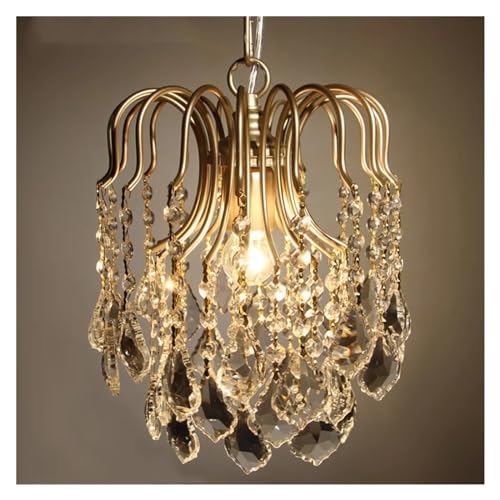 Lampe suspendue en cristal crée une ambiance chaleureuse dans la chambre