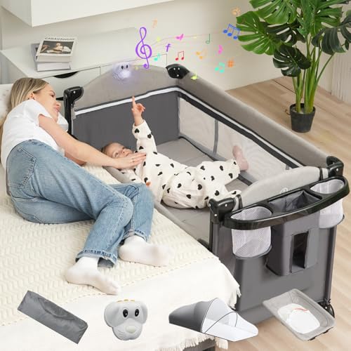 Image of Youluzhen 5 in 1 Baby Bassinet Bedside Sleeper,Pack and Play Bassinet with Diaper Changer/Mattress/Music,Bedside Crib with Storage,Playard with Bassinet from Newborn to Toddler
